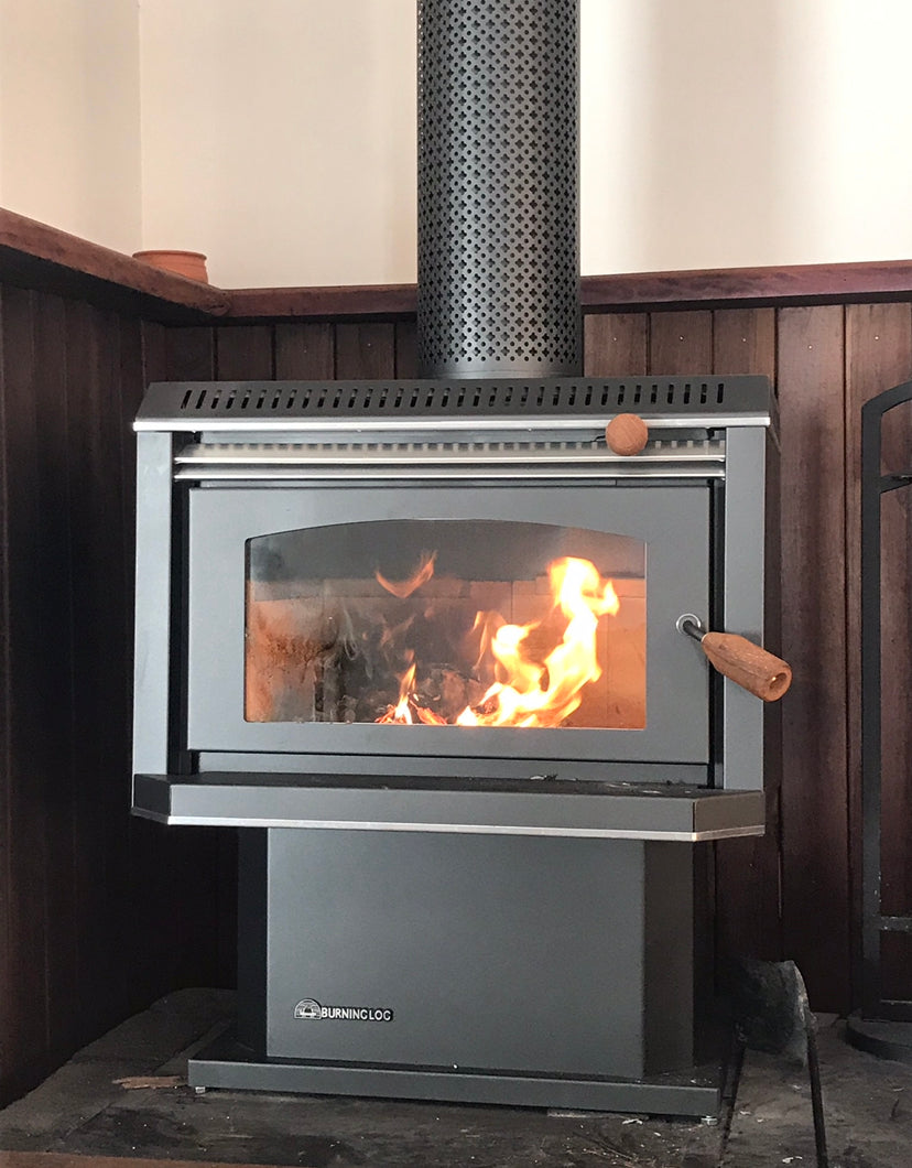 Black metallic Burning Log Turbo 10 wood fireplace with a modern design, showcasing the log burner’s sleek appearance and fire chamber.