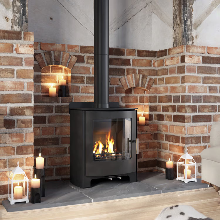 Churchill 5 Convection Dual Control wood heater installed in a traditional brick fireplace setting
