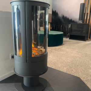 ilektro i650 Freestanding electric fireplace with cylindrical black body and glowing log display