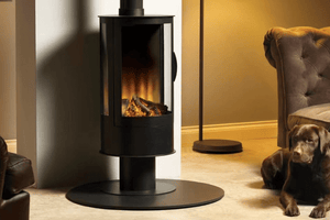 ilektro i650 Freestanding electric fireplace with three-sided curved glass in a modern living room