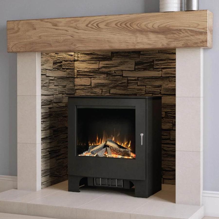 ilektro Woodland electric stove installed in a traditional fireplace hearth