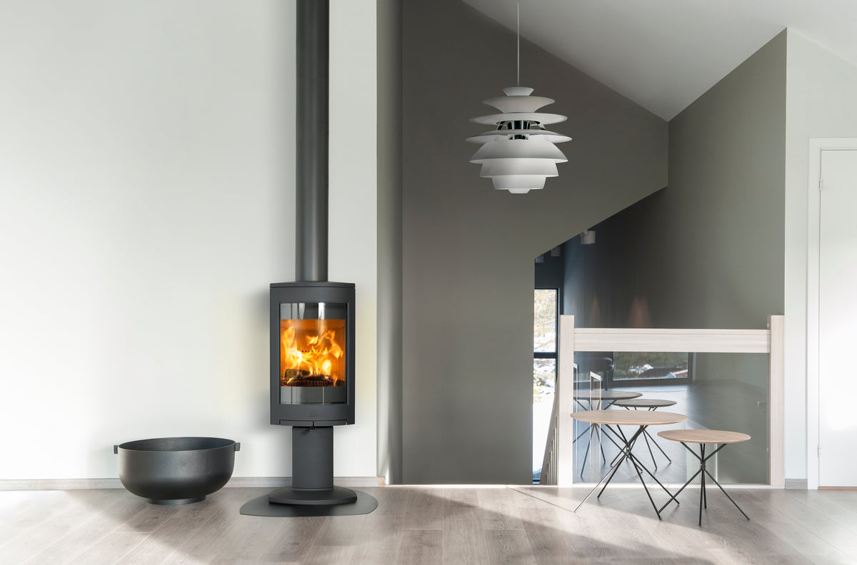 Jøtul F 370 V2 Advance wood heater with pedestal base in a contemporary interior