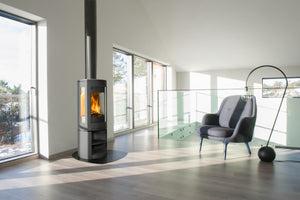 Jøtul F 370 V2 Advance three-sided wood heater installed in a bright contemporary home