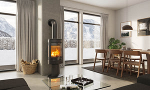 Jøtul F 370 V2 Advance wood fireplace installed in a contemporary living and dining room