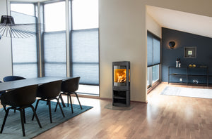 Jøtul F 370 V2 Advance wood heater installed in a modern open-plan home