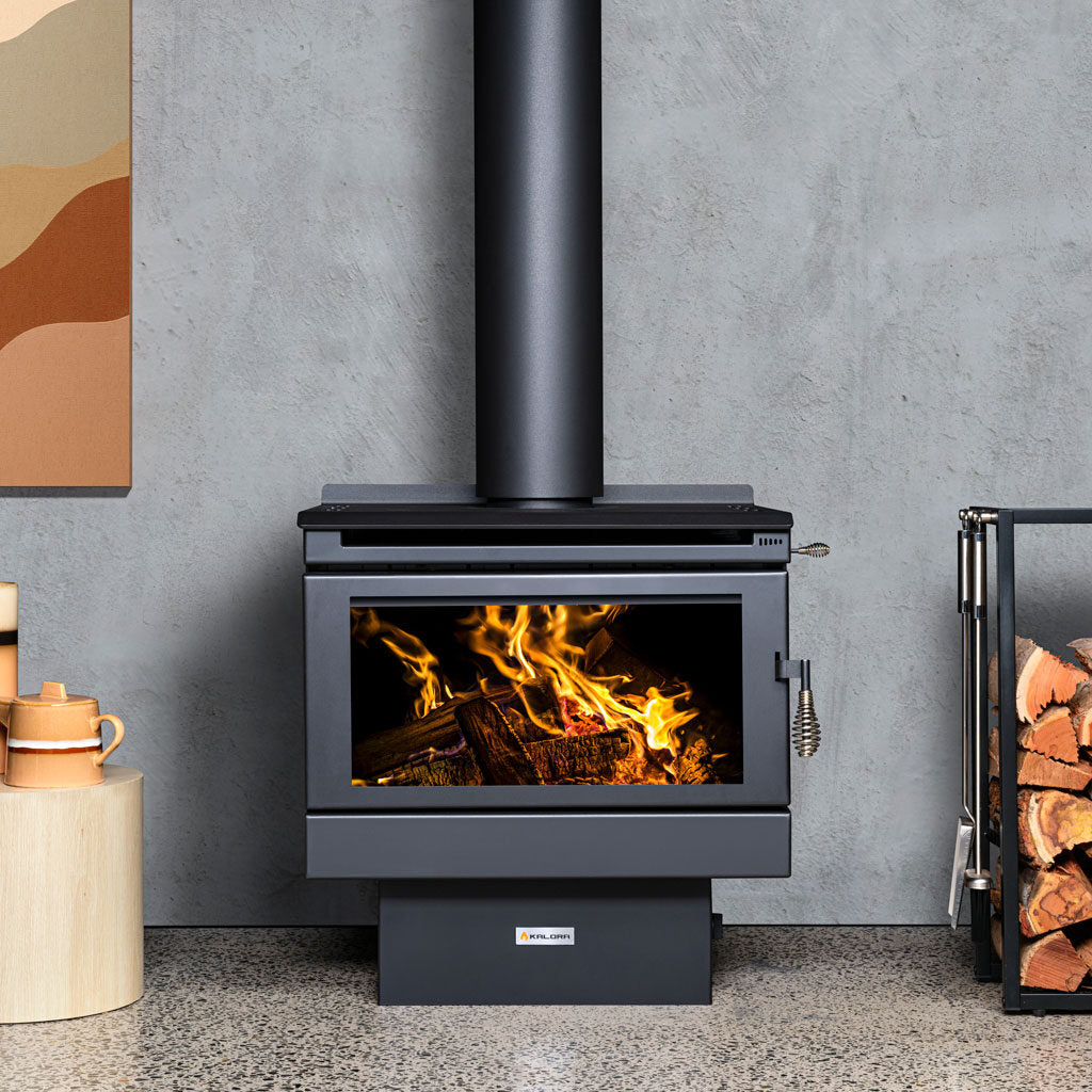 Kalora Chalet 6 fan-forced freestanding wood heater installed in a modern living room
