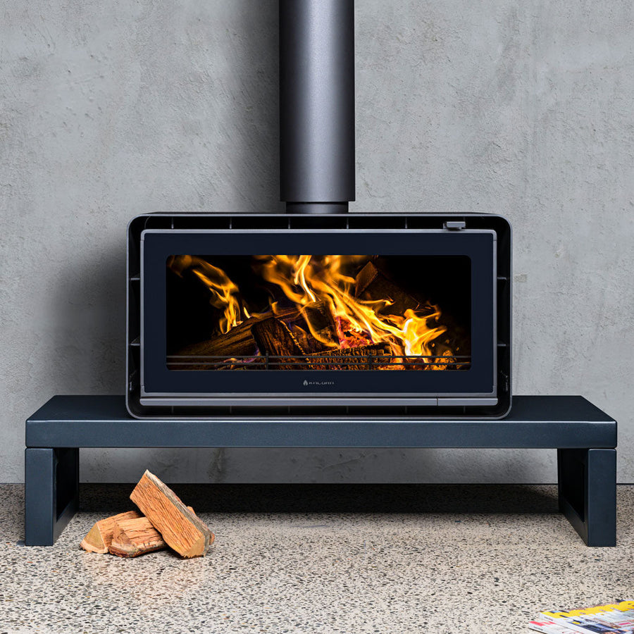 Kalora Urban LS landscape wood heater installed on contemporary plinth