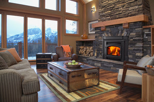 Quadra-Fire Expedition 2 wood insert installed in a stone fireplace