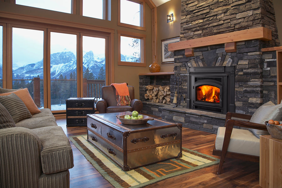 Quadra-Fire Expedition 2 wood insert installed in a stone fireplace