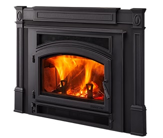 Quadra-Fire Expedition wood insert with decorative cast fireplace surround