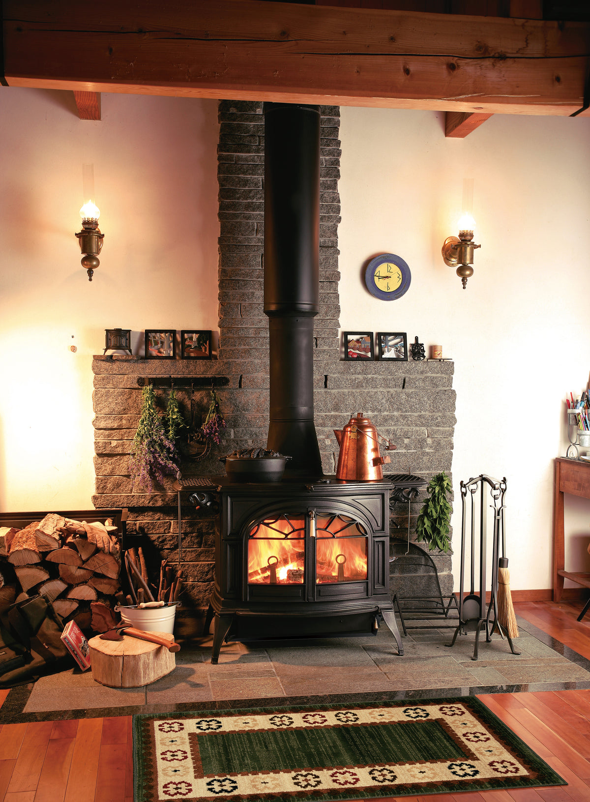 Vermont Castings Defiant black cast iron wood heater installed in a traditional living room