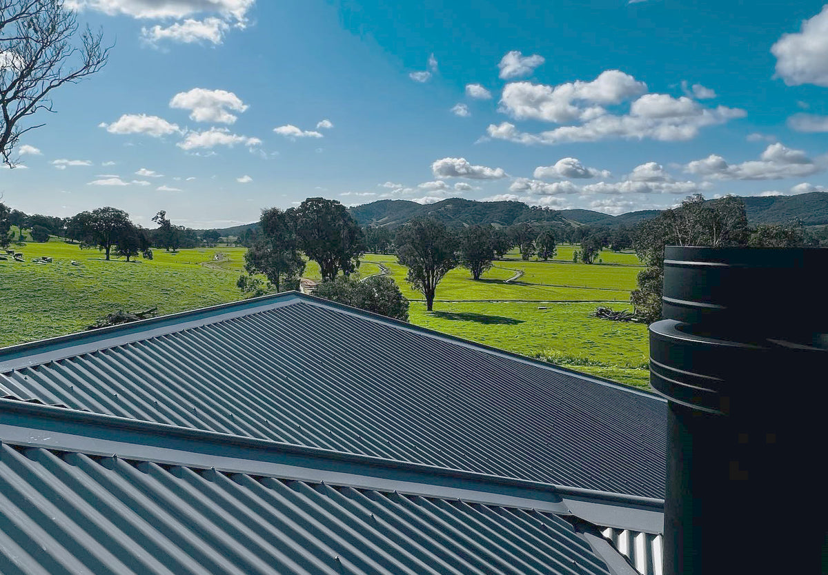 VisionLINE pellet heater flue installed through a metal roof in Regional NSW