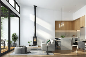 VisionLINE Pera freestanding wood heater in an open-plan living and kitchen area