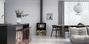 VisionLINE Phoenix freestanding wood heater with wood-storage pedestal in a modern home