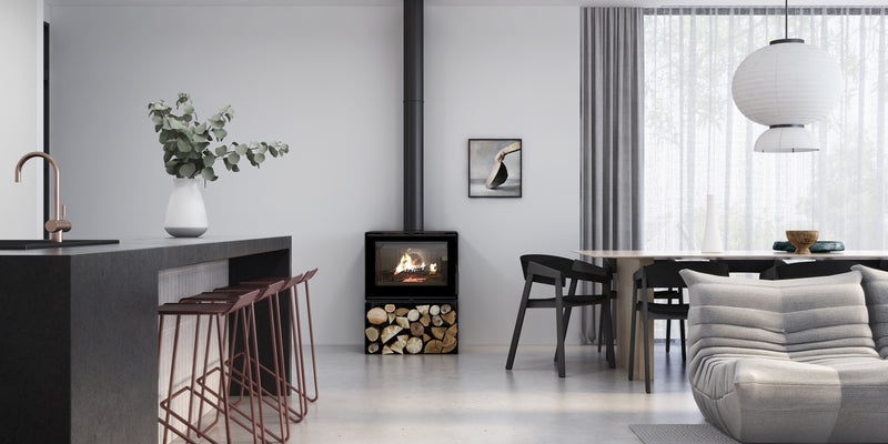 VisionLINE Phoenix freestanding wood heater with wood-storage pedestal in a modern home