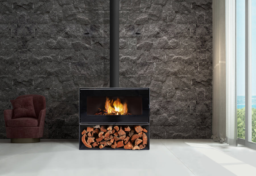 VisionLINE Taurus freestanding wood heater with wood storage base in a modern home