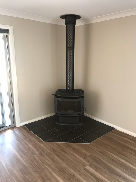 Warmglo Ranger 2500 wood fireplace with a classic brick interior and a sturdy metal frame, designed for cozy heating.