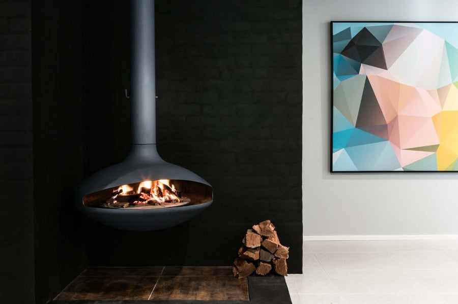 Aurora Aether suspended wood fireplace in a contemporary living room