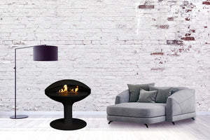Aurora Milai freestanding bioethanol fireplace with pedestal base in a contemporary living room