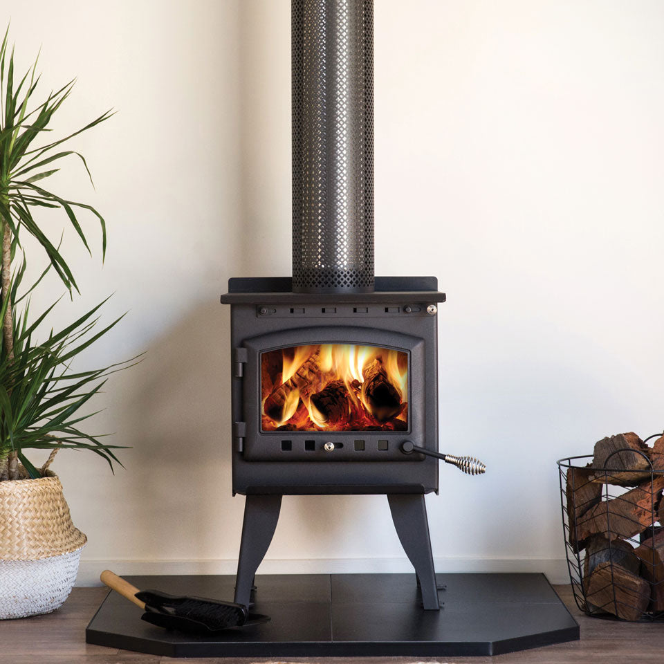 Kalora 425R radiant wood heater installed on a corner hearth